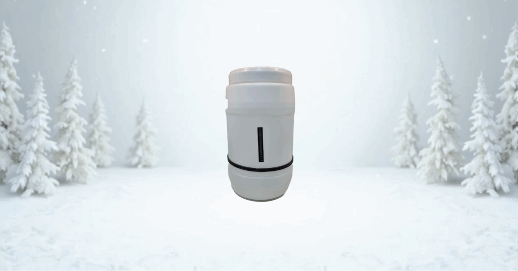 Insulated tumbler in snowy forest setting